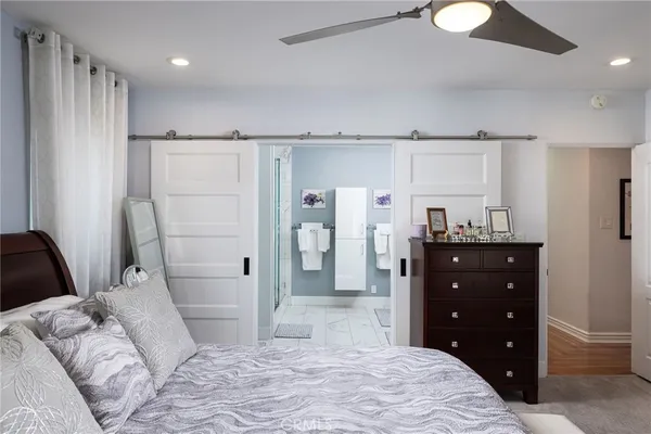 a bathroom with a double vanity sink mirror and shower