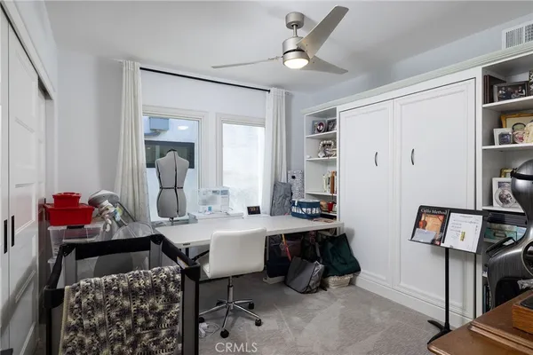a bathroom with a tub sink a window and a shower