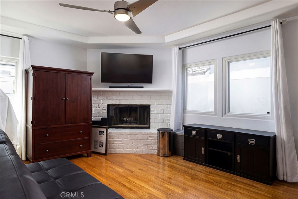 90 Rivo Alto Canal Long Beach, CA 90803 - Photo 33 of 52 a living room with a fireplace and a television