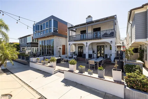 a view of multiple houses with outdoor seating