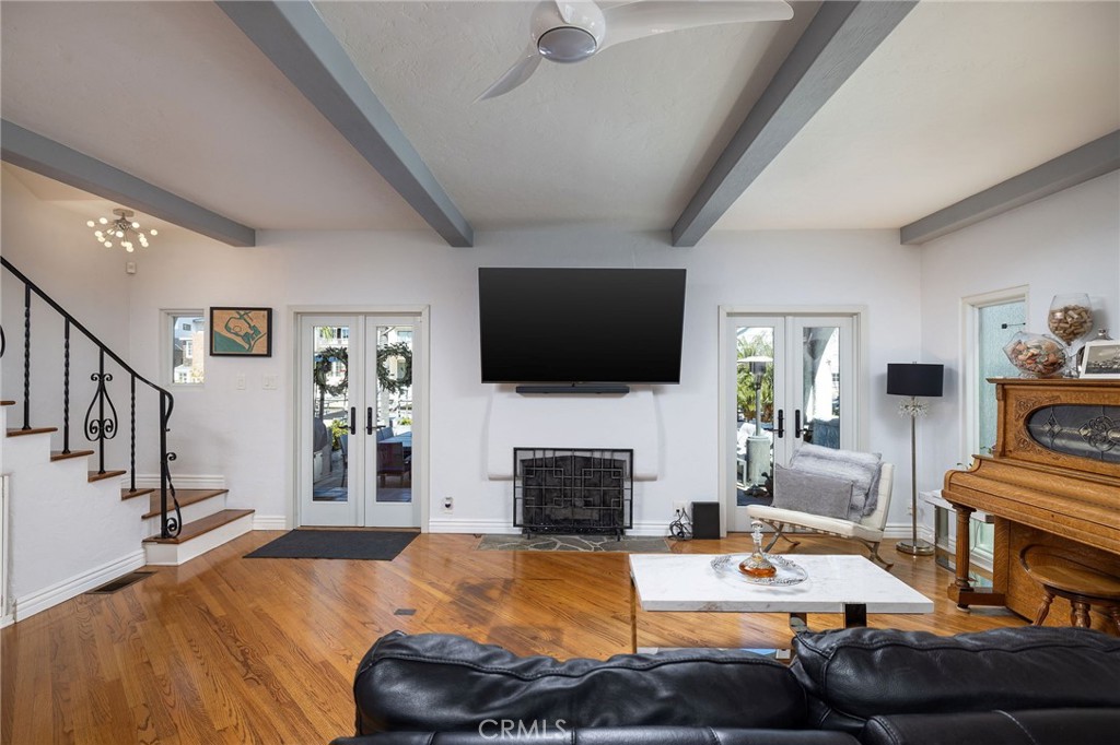 90 Rivo Alto Canal Long Beach, CA 90803 - Photo 10 of 52 a living room with furniture a fireplace and a flat screen tv
