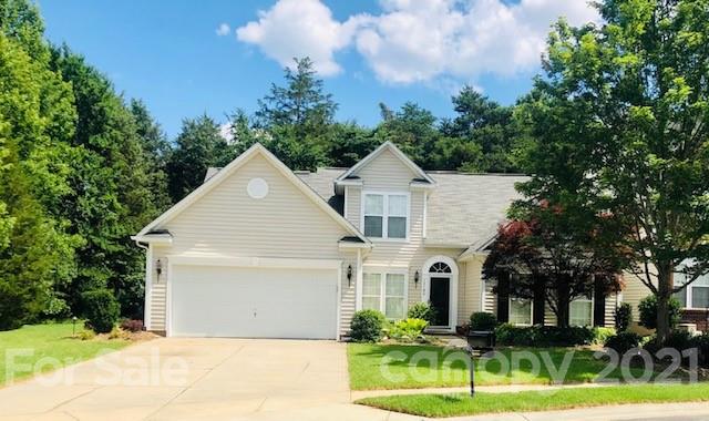 13105 Jansen Ridge Way Charlotte, NC 28278 - Photo 1 of 1 a front view of a house with a yard and garage