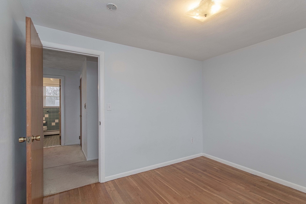 71 Vallaro Road Boston, MA 02136 - Photo 19 of 37 wooden floor in a hall with an entryway