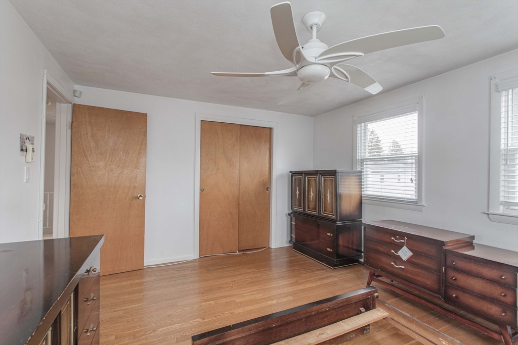 71 Vallaro Road Boston, MA 02136 - Photo 22 of 37 a living room with furniture and wooden floor