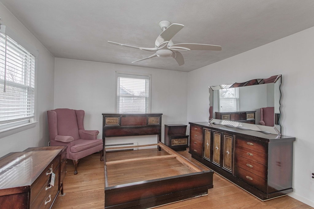 71 Vallaro Road Boston, MA 02136 - Photo 23 of 37 a living room with furniture and a dresser