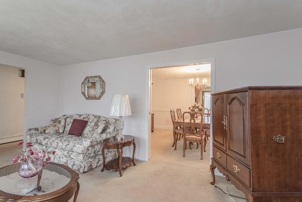 71 Vallaro Road Boston, MA 02136 - Photo 6 of 37 a living room with furniture and a window
