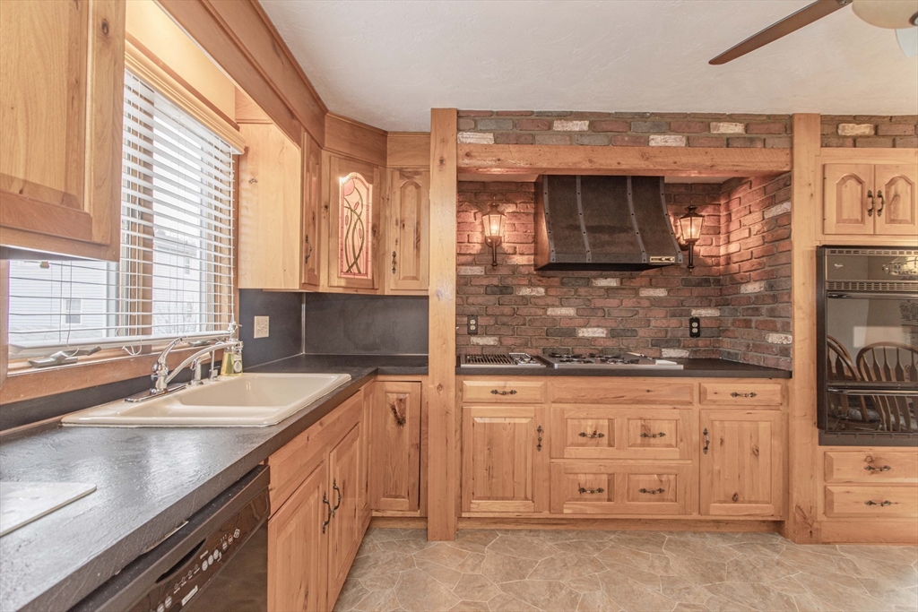 71 Vallaro Road Boston, MA 02136 - Photo 9 of 37 a kitchen with stainless steel appliances granite countertop a sink stove and cabinets