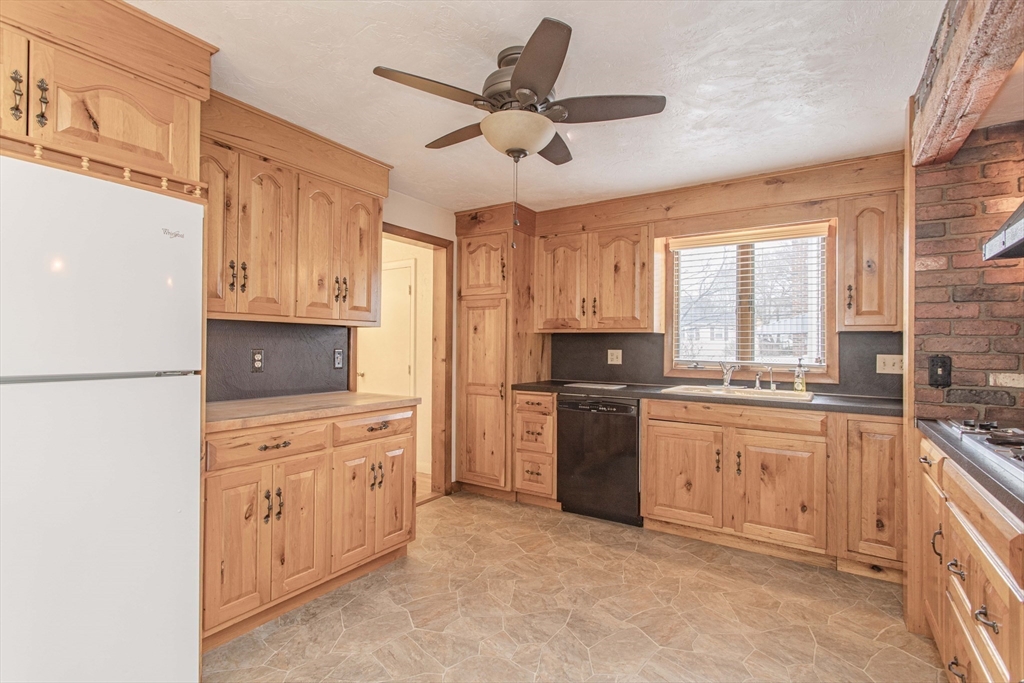 71 Vallaro Road Boston, MA 02136 - Photo 10 of 37 a kitchen with granite countertop a sink stainless steel appliances and counter space
