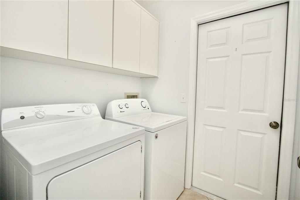 7842 Tenby Court New Port Richey, FL 34655 - Photo 17 of 27 a utility room with dryer and washer