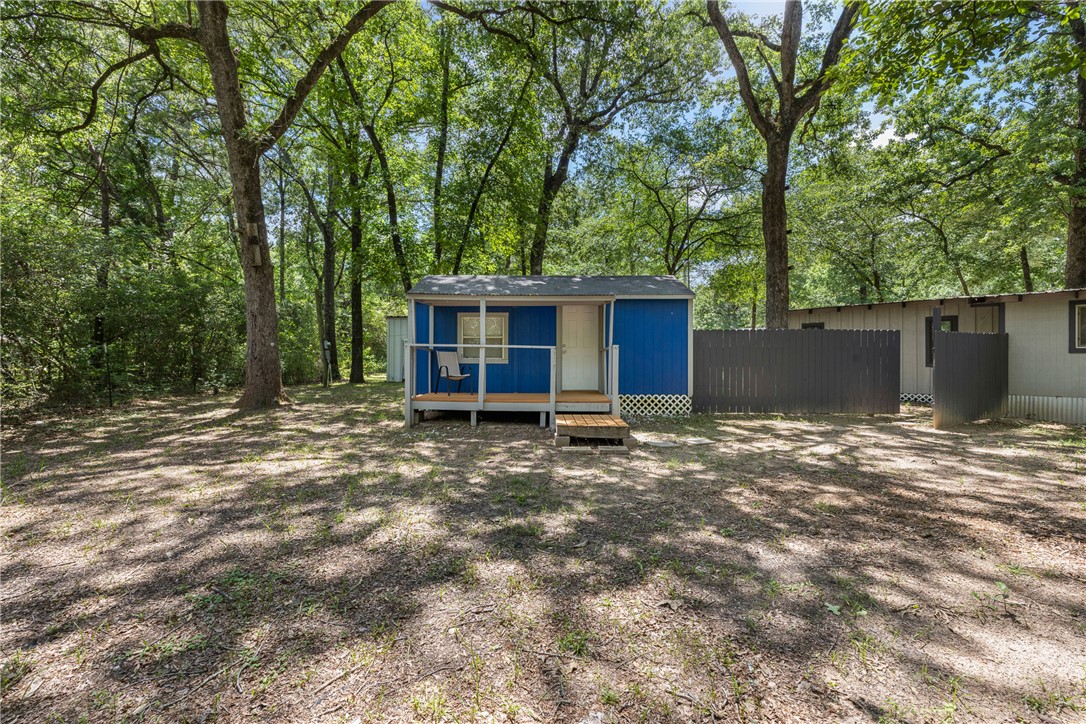 12255 County Road Centerville, TX 75833 - Photo 16 of 26 a view of a house with a yard and large tree