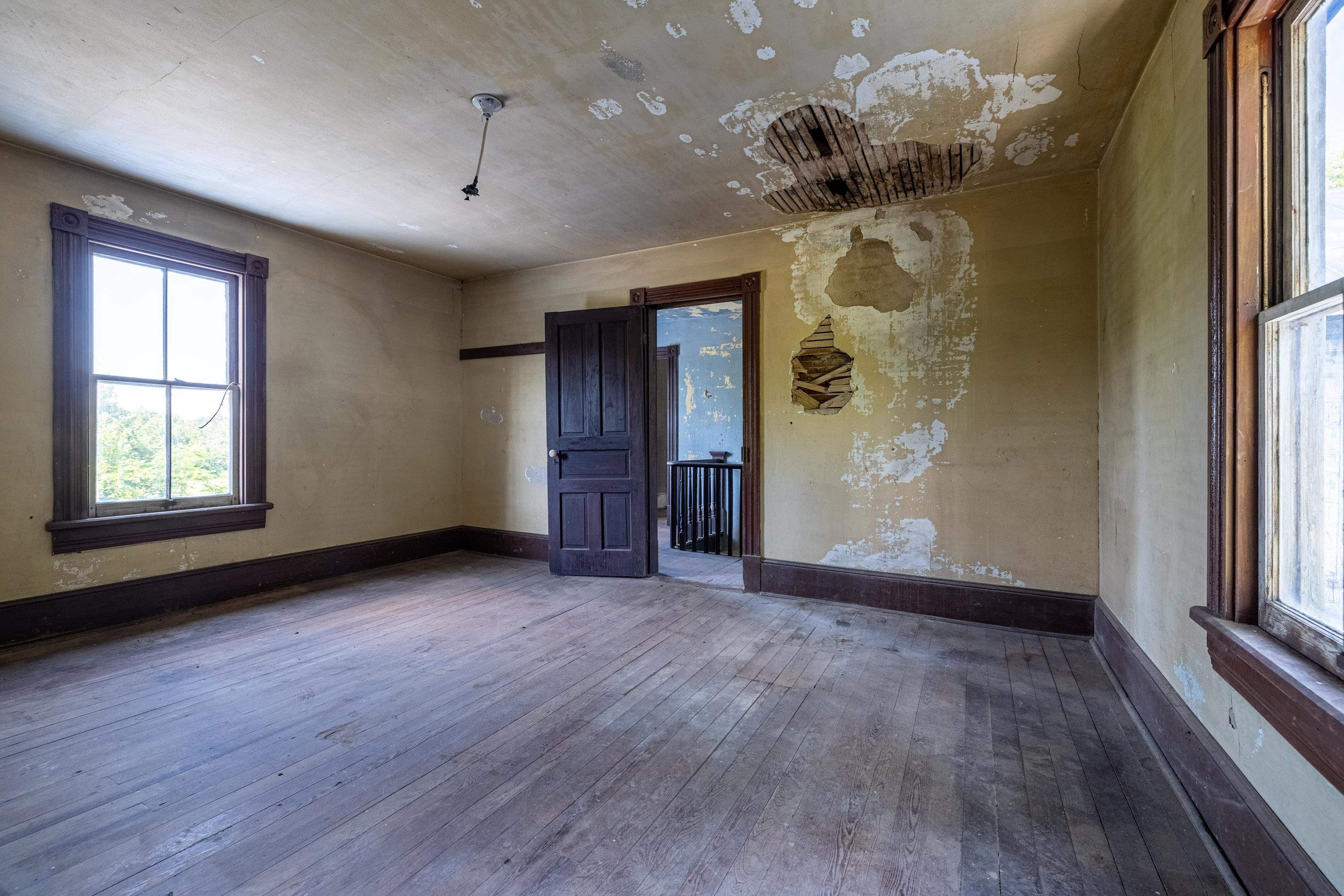 2012 Kimball Road Luray, VA 22835 - Photo 21 of 56 an empty room with wooden floor chandelier fan and windows