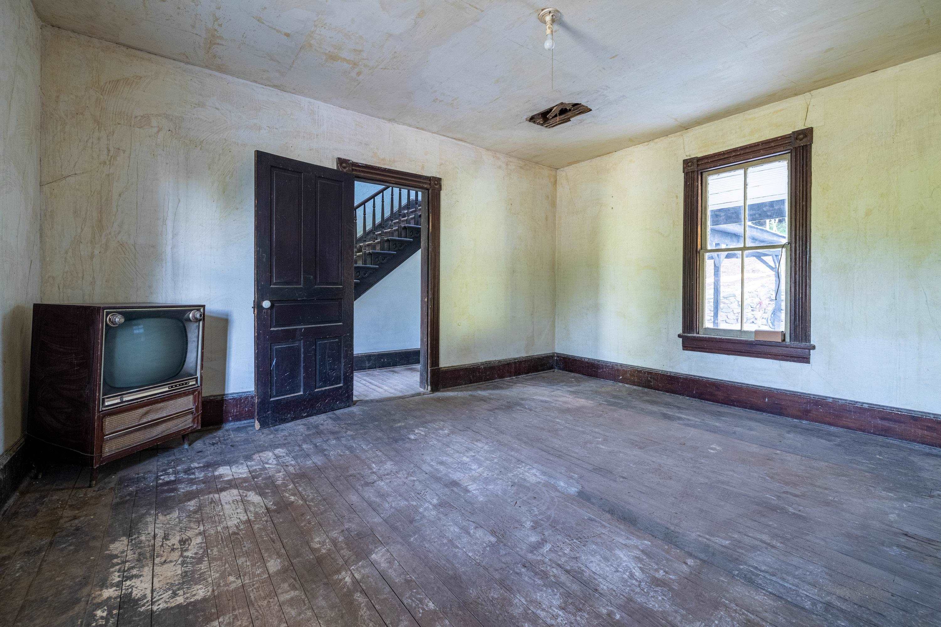 2012 Kimball Road Luray, VA 22835 - Photo 4 of 56 an empty room with windows cabinet and flat screen tv