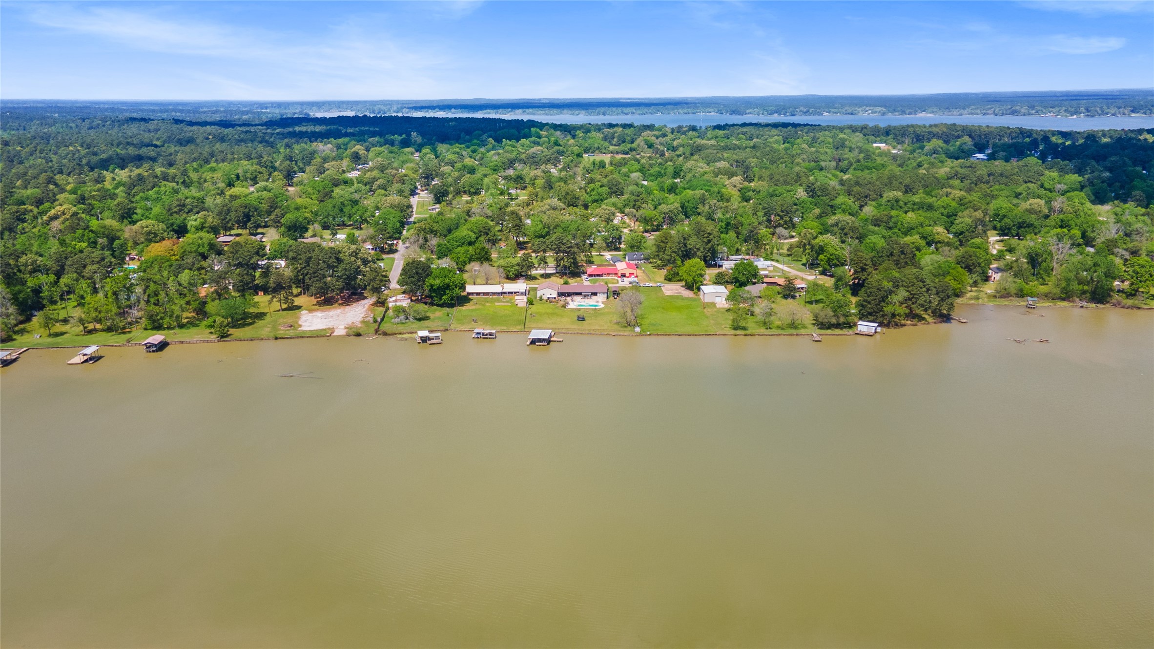 174 Lake Front Drive Trinity, TX 75862 - Photo 42 of 44 a view of a lake from a yard
