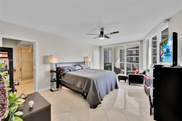a bedroom with a bed and a mirror