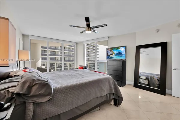 a spacious bedroom with a bed and furniture