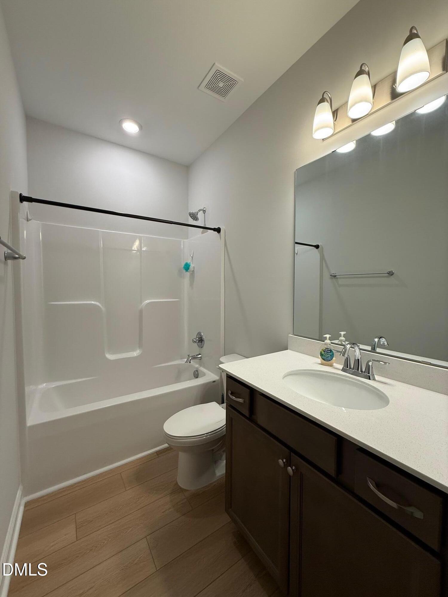 230 George Pine Way Knightdale, NC 27545 - Photo 14 of 31 a bathroom with a sink a toilet a mirror and shower