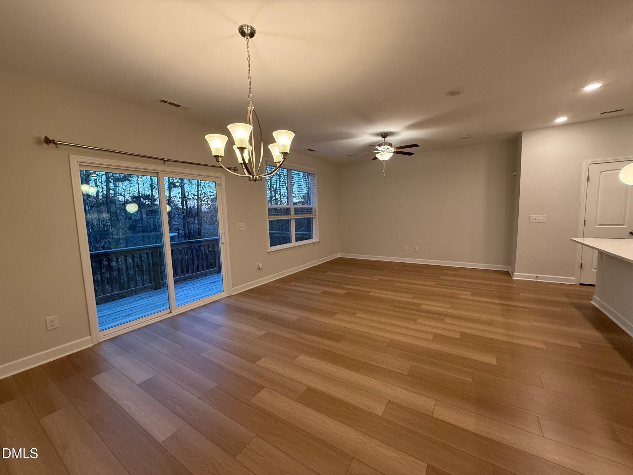 230 George Pine Way Knightdale, NC 27545 - Photo 23 of 31 a view of a room with a large window and chandelier