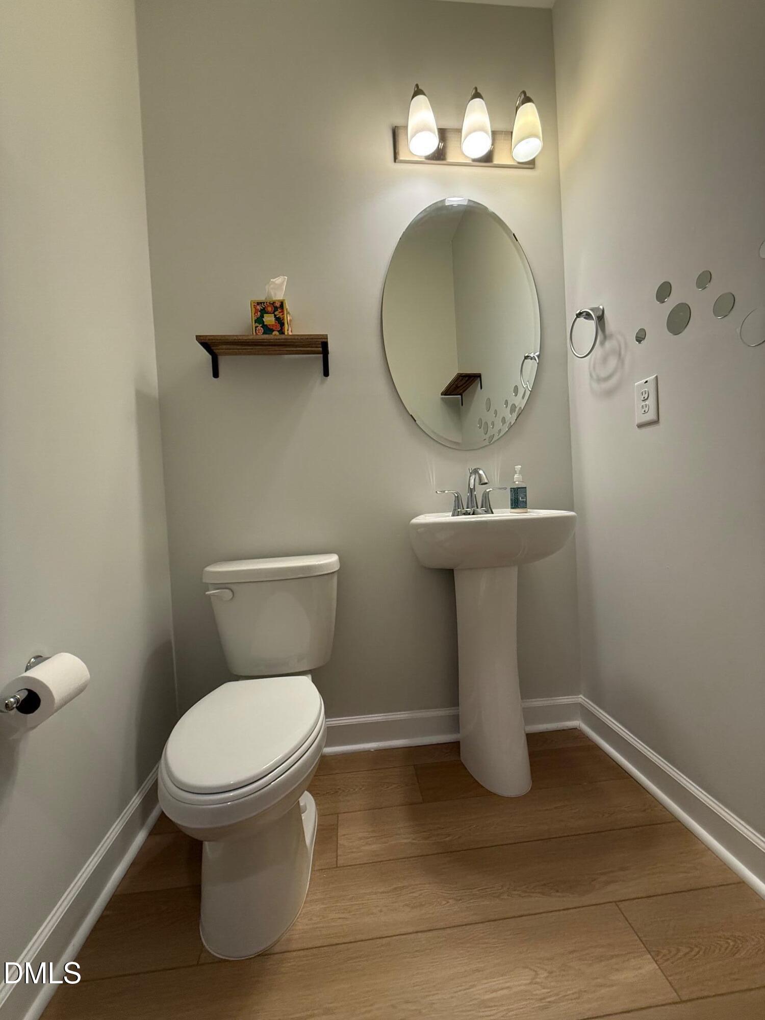 230 George Pine Way Knightdale, NC 27545 - Photo 26 of 31 a bathroom with a toilet sink and mirror