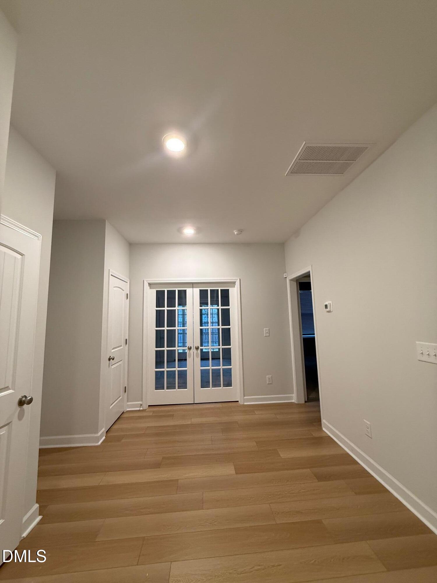 230 George Pine Way Knightdale, NC 27545 - Photo 6 of 31 a view of empty room with wooden floor and fan