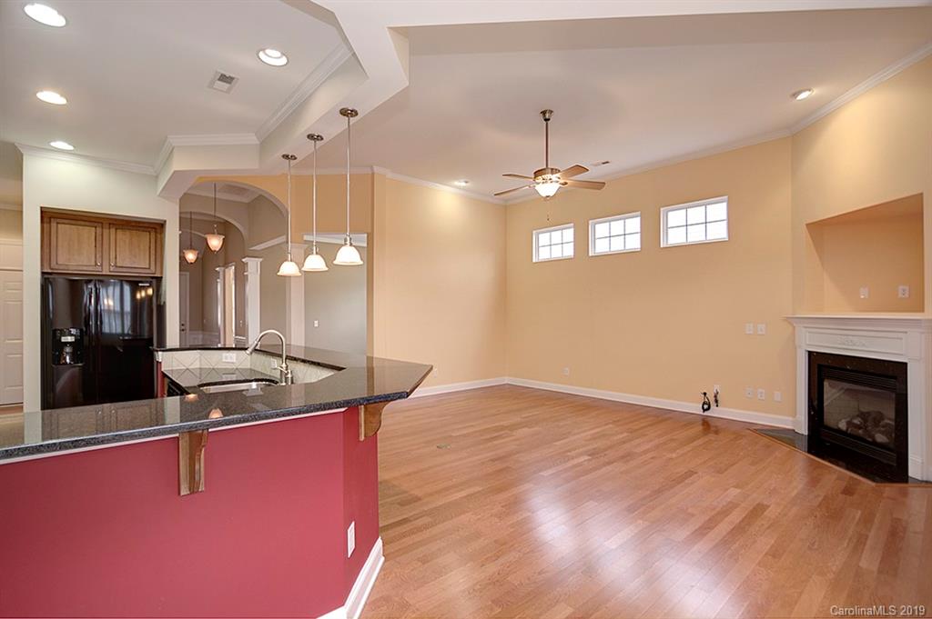 907 Treasure Court Fort Mill, SC 29708 - Photo 14 of 31 a kitchen with stainless steel appliances granite countertop a sink a stove and a wooden floors