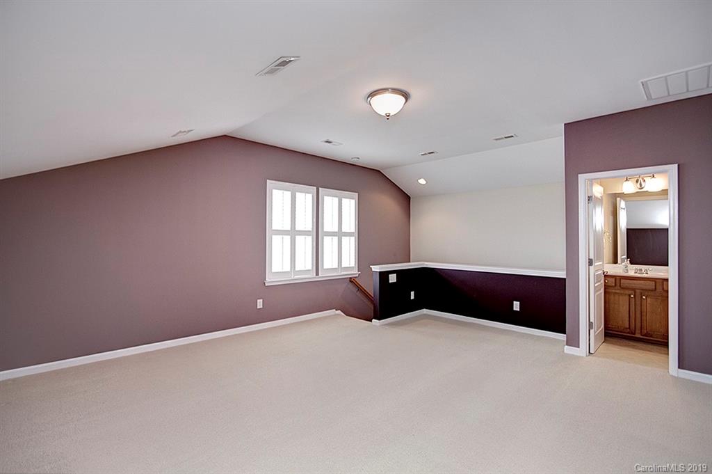 907 Treasure Court Fort Mill, SC 29708 - Photo 23 of 31 a bedroom with a bed and a window