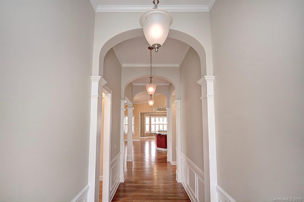 907 Treasure Court Fort Mill, SC 29708 - Photo 4 of 31 a view of a hallway with wooden floor