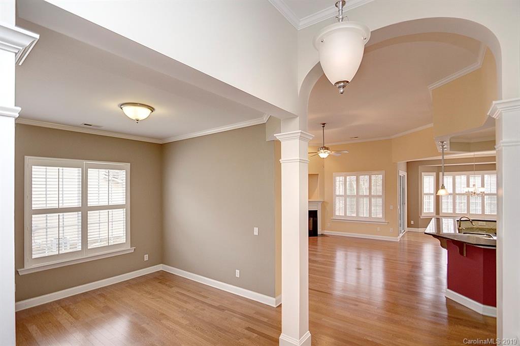 907 Treasure Court Fort Mill, SC 29708 - Photo 5 of 31 a view of an empty room with wooden floor and a window