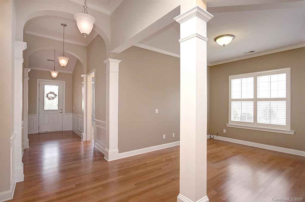 907 Treasure Court Fort Mill, SC 29708 - Photo 6 of 31 an empty room with wooden floor and windows