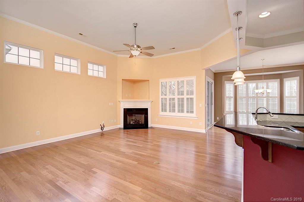 907 Treasure Court Fort Mill, SC 29708 - Photo 8 of 31 a view of an empty room with wooden floor and a window