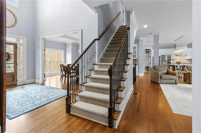 a living room with furniture and kitchen view
