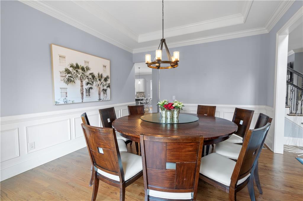 1625 Hamiota Ridge Alpharetta, GA 30004 - Photo 18 of 86 a view of a dining room with furniture and wooden floor
