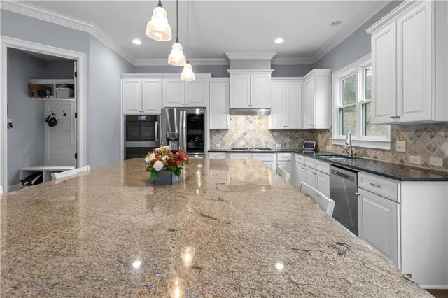 a view of a hallway with workspace and entryway