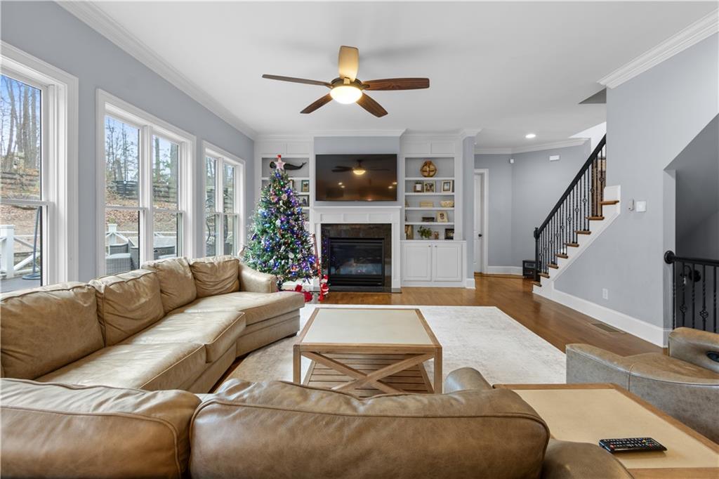 1625 Hamiota Ridge Alpharetta, GA 30004 - Photo 23 of 86 a living room with furniture and a fireplace