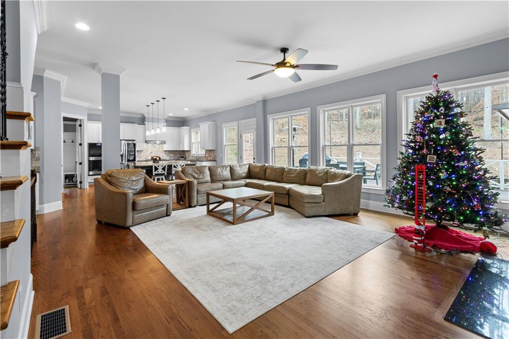 1625 Hamiota Ridge Alpharetta, GA 30004 - Photo 24 of 86 a living room with furniture and a chandelier
