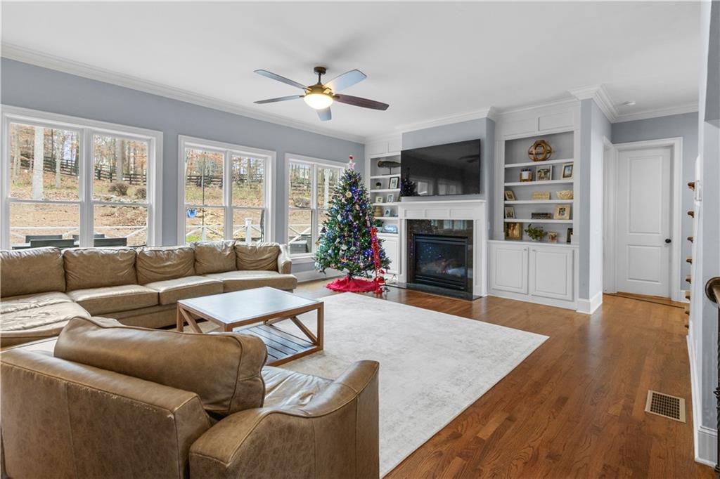 1625 Hamiota Ridge Alpharetta, GA 30004 - Photo 26 of 86 a living room with furniture fireplace and flat screen tv