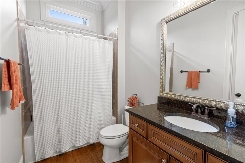 1625 Hamiota Ridge Alpharetta, GA 30004 - Photo 29 of 86 a bathroom with a granite countertop sink toilet and shower