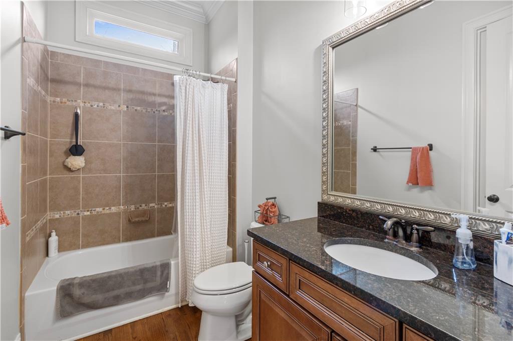 1625 Hamiota Ridge Alpharetta, GA 30004 - Photo 30 of 86 a bathroom with a granite countertop sink toilet mirror and shower