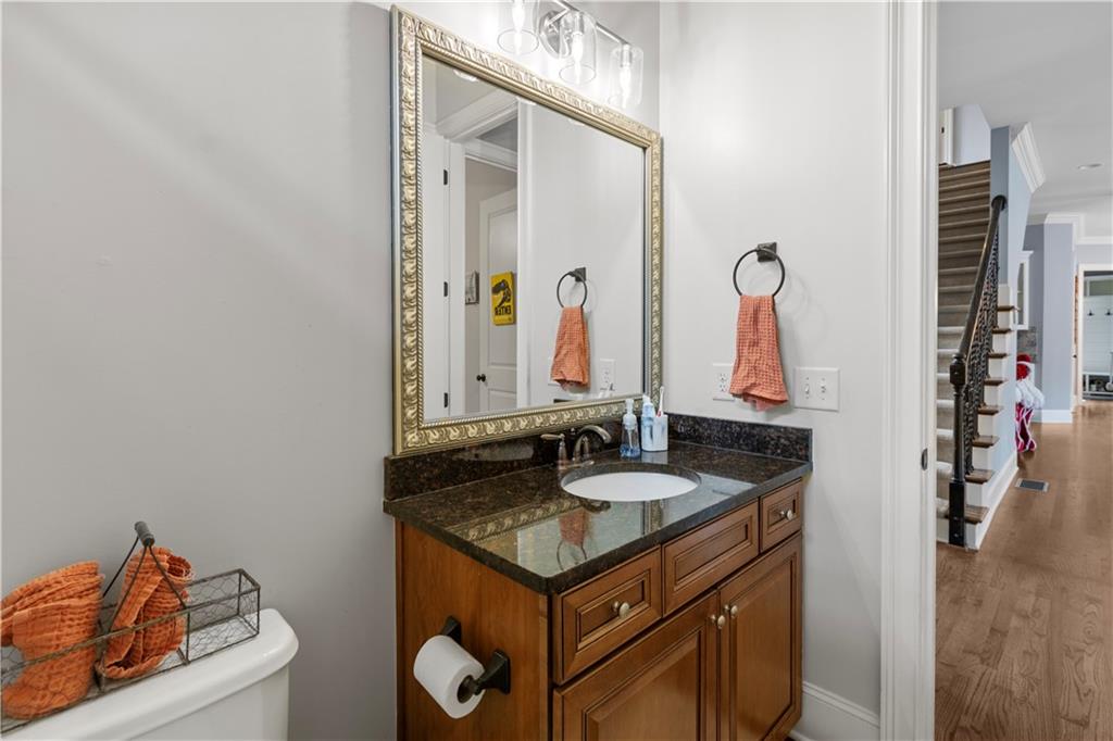 1625 Hamiota Ridge Alpharetta, GA 30004 - Photo 31 of 86 a bathroom with a granite countertop sink and a mirror