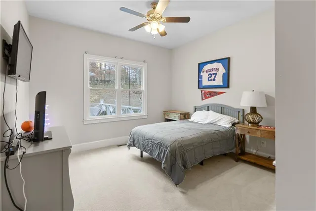 a bathroom with a sink a light fixture and a mirror