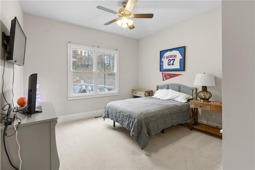 1625 Hamiota Ridge Alpharetta, GA 30004 - Photo 32 of 86 a bedroom with a bed furniture and a window