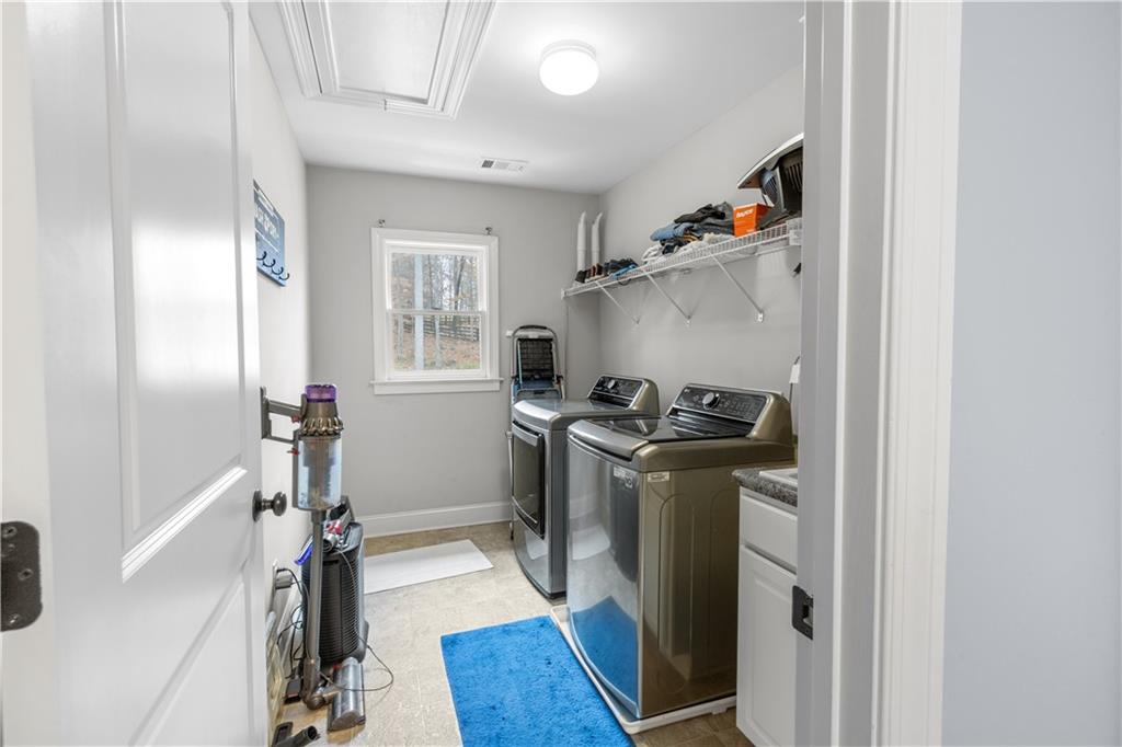1625 Hamiota Ridge Alpharetta, GA 30004 - Photo 36 of 86 a kitchen with a stove and a refrigerator