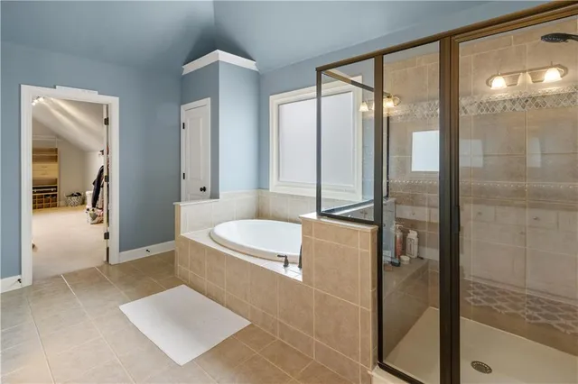 a view of a house with wooden fence