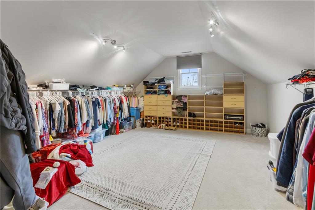 1625 Hamiota Ridge Alpharetta, GA 30004 - Photo 44 of 86 a view of walk in closet with clothes and shoes