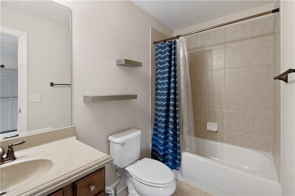 1625 Hamiota Ridge Alpharetta, GA 30004 - Photo 47 of 86 a bathroom with a sink a toilet and shower