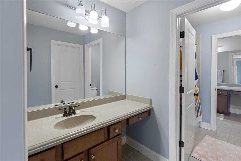 1625 Hamiota Ridge Alpharetta, GA 30004 - Photo 53 of 86 a bathroom with a sink vanity and a mirror