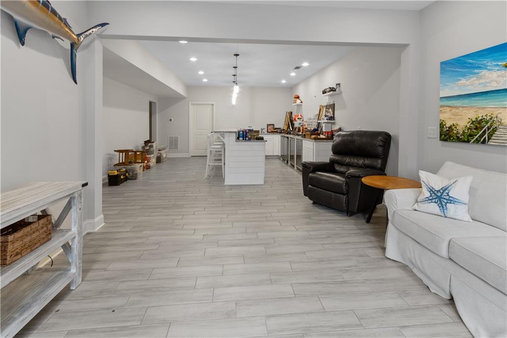 1625 Hamiota Ridge Alpharetta, GA 30004 - Photo 57 of 86 a living room with furniture and a flat screen tv
