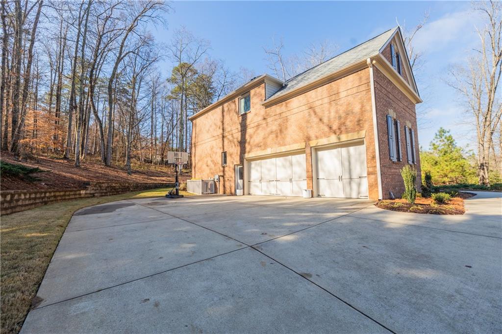 1625 Hamiota Ridge Alpharetta, GA 30004 - Photo 64 of 86 a view of an house with backyard and tree