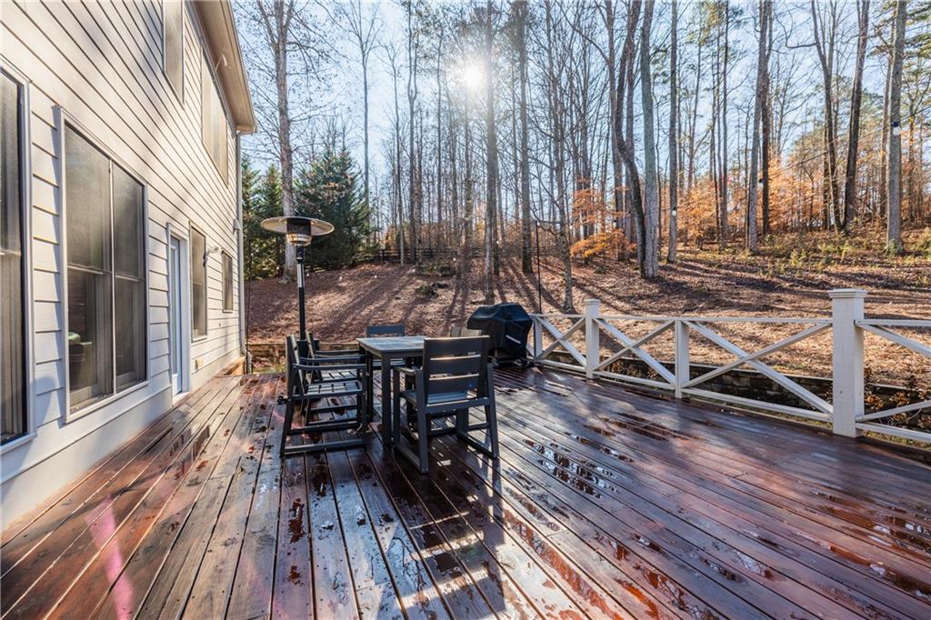1625 Hamiota Ridge Alpharetta, GA 30004 - Photo 70 of 86 a view of balcony with wooden floor and outdoor seating