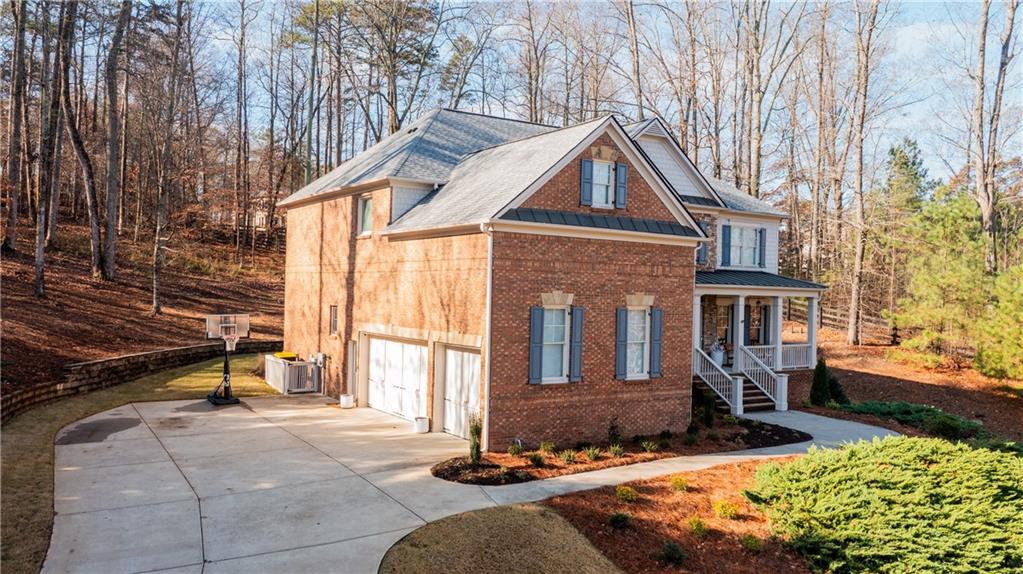 1625 Hamiota Ridge Alpharetta, GA 30004 - Photo 75 of 86 a front view of house with yard
