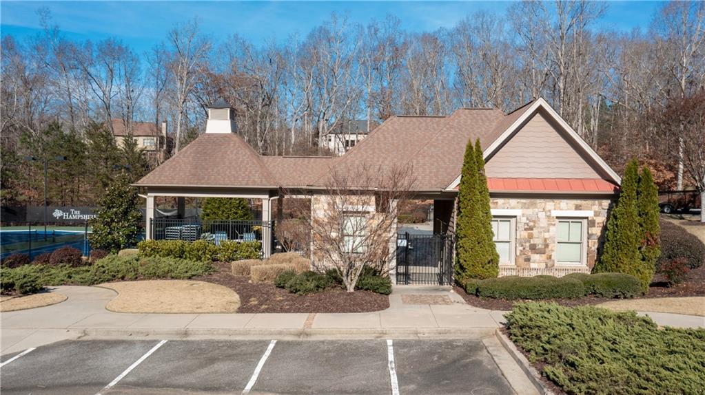 1625 Hamiota Ridge Alpharetta, GA 30004 - Photo 80 of 86 a front view of a house with garden